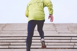 man running up steps